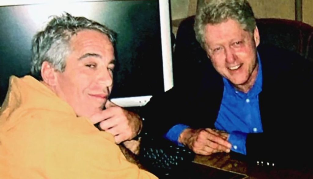 Jeffrey Epstein and Bill Clinton at a table together