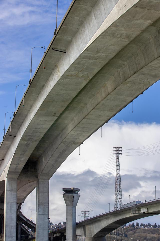 An image of the West Seattle Bridge from below, an angle that makes it seem large and soaring