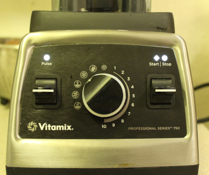 The photo shows a close-up of the Vitamix Professional 750 area of dials and switches.