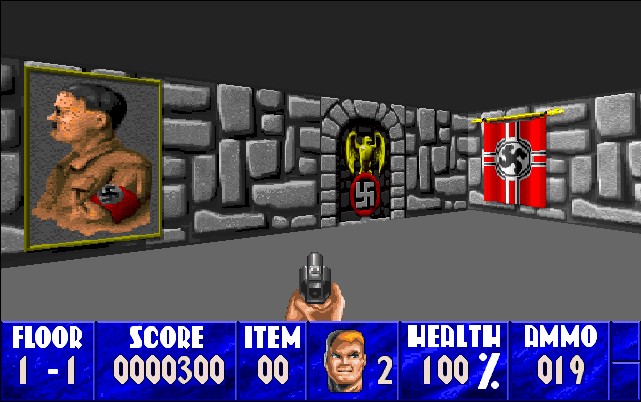 The image shows a screenshoot from the game. It's a low-tech three-dimensional shooter from the first person perspective. The player sees their gun. They're in a stone castle, where images of swastikas and Hitler decorate the walls.