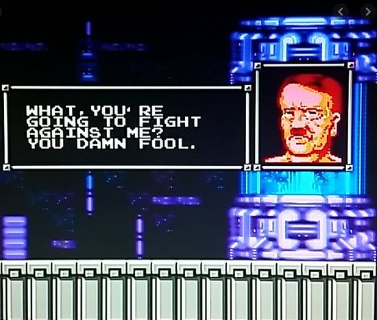 The image is from the video game. It shows Hitler's face as he's being resurrected out of some sci-fi cryo chamber. According to the dialogue box, he's saying to the player:  "What, you're going to fight against me? You damn fool."