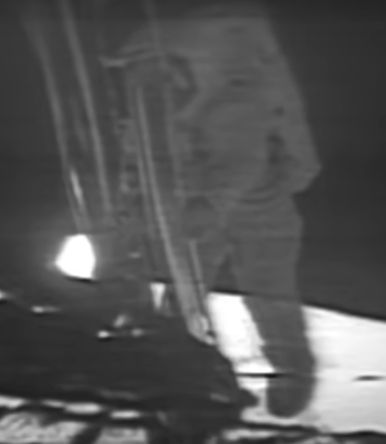 The black-and-white footage clip shows Neil Armstrong walking down the ladder of the Apollo 11 lunar module.