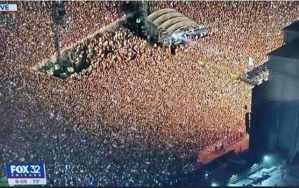 The color image is a screenshot of a Chicago FOX News television affiliate showing an aerial view of the huge Lollapalooza crowd this weekend.