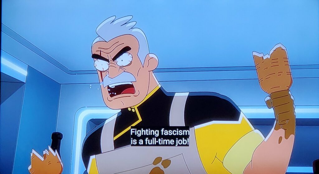 Screenshot from an anime shows an angry male character saying: "Fighting fascism is a full-time job!"