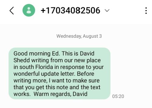 The image shows a text-message sent from 17034082506 on Wednesday August 3 at 5:20 a.m. The message reads: "Good morning Ed. This is David Shedd writing from our new place in south Florida in response to your wonderful update letter. Before writing more, I want to make sure that you get this note and the text works.  Warm regards, David"